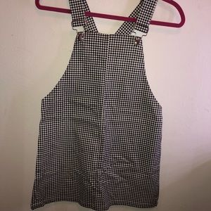 Black and white checkered overalls.